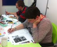 a group of people sitting at a desk